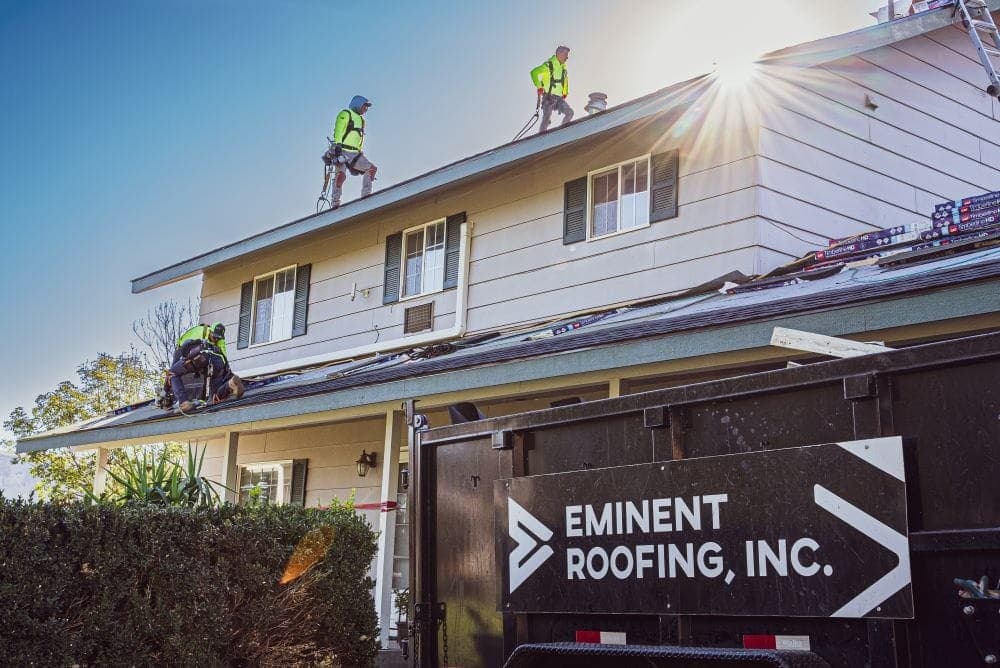 Eminent Roofing crew installing a new roof on a Tri-Cities home