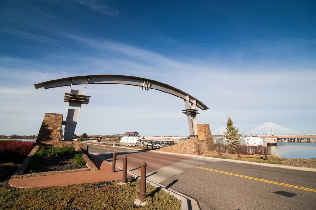 Kennewick gateway arch with the Columbia River and Cable Bridge