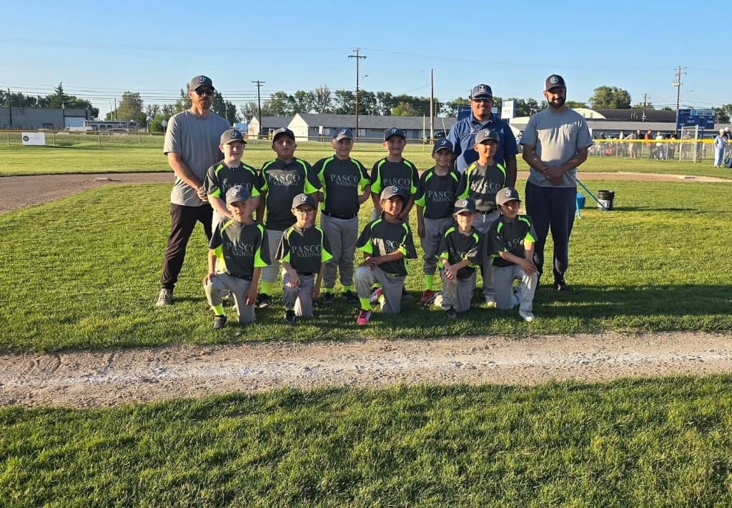 Pasco youth baseball field with players, a place Eminent Roofing supports in the community
