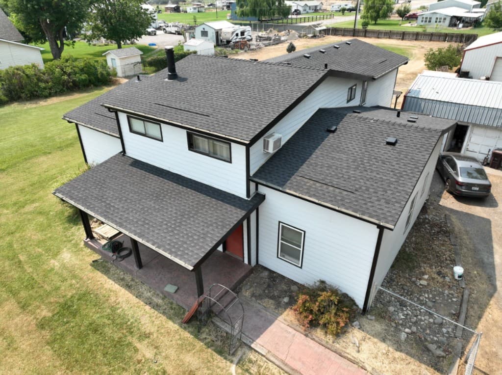 Roofing crew installing architectural shingles on a Tri-Cities home