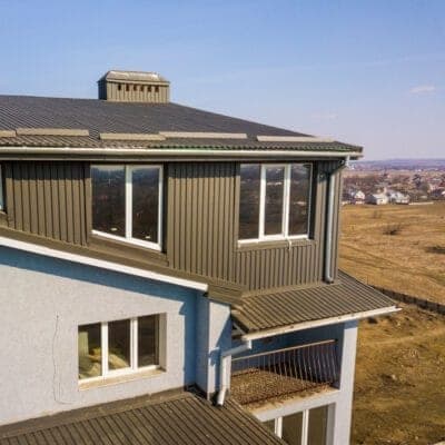 Vertical metal panel siding on a residential wall