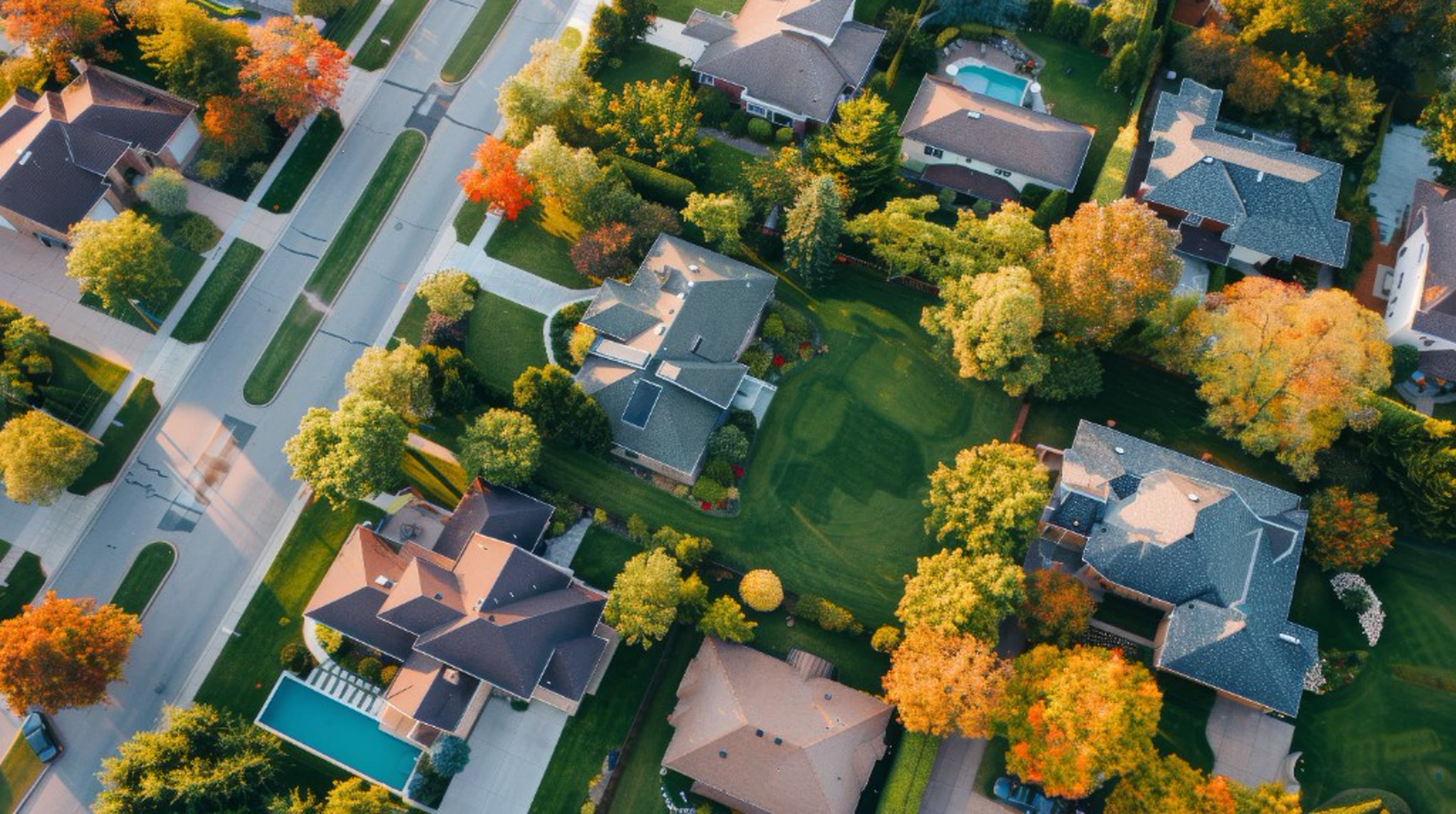 Aerial view of a residential neighborhood with mature trees, representing homes we serve in Benton City, Washington
